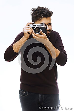 Photographer. Close up portrait of guy holding vintage camera Stock Photo