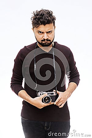 Photographer. Close up portrait of guy holding vintage camera Stock Photo