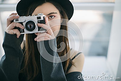 Photographer eyes. Beautiful ypung woman. Creative hobby and job Stock Photo