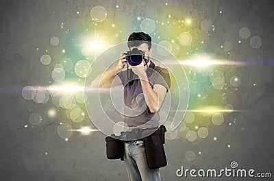Photographer with flashing lights Stock Photo
