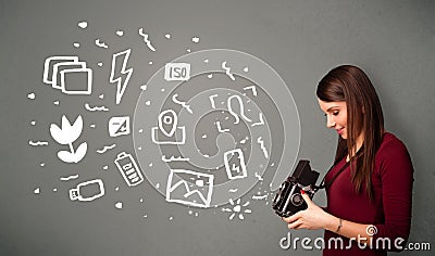 Photographer girl capturing white photography icons and symbols Stock Photo