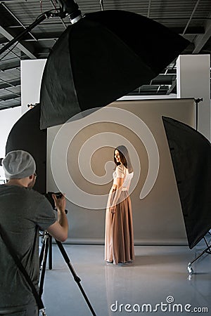 Photographer and happy model at studio session Stock Photo