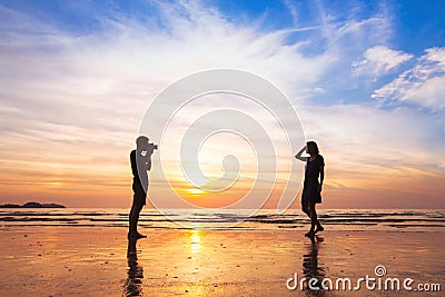 Photographer and model, beach photo shooting Stock Photo