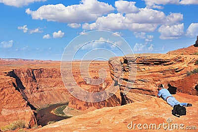 The photographer photographed lying on dangerous shore Stock Photo