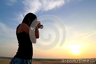 Photographer Photographing at Sunrise Stock Photo