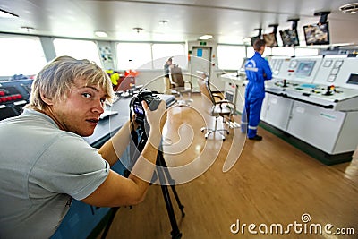 Photographer reporter photographing the operator control panel. Everyday life of the photographer Stock Photo