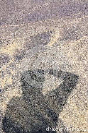 Photographer shadow on beach Stock Photo