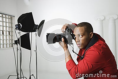 Photographer in studio. Stock Photo