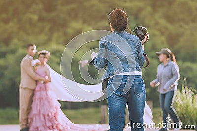 Photographer take pre-wedding photos of the bride and groom in t Stock Photo