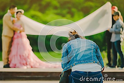 Photographer take pre-wedding photos of the bride and groom in t Editorial Stock Photo