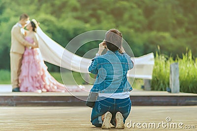 Photographer take pre-wedding photos of the bride and groom in t Editorial Stock Photo