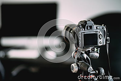 photographer taking indoor pictures of newly renovated office. Camera on tripod details Stock Photo