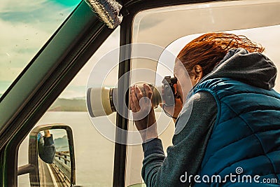 Photographer taking photo from camper car Stock Photo