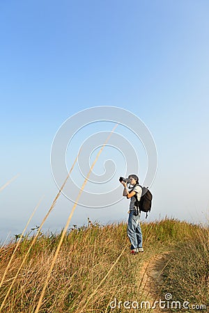 Photographer taking photo outdoor Stock Photo