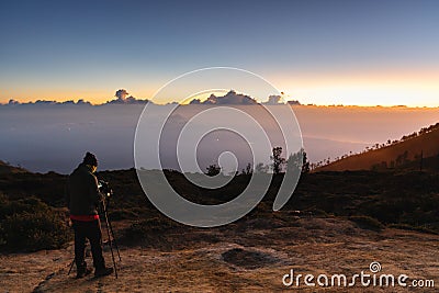 Photographer taking photography sunrise landscape on the mountain in the dawn Editorial Stock Photo