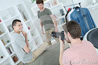 Photographer taking picture two young models Stock Photo