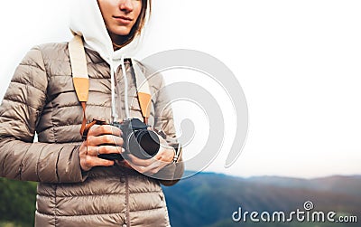 Photographer traveler on green mountain, tourist holding in hands digital photo camera closeup, hiker taking click photography, gi Stock Photo