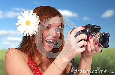 Photographer woman holding camera Stock Photo