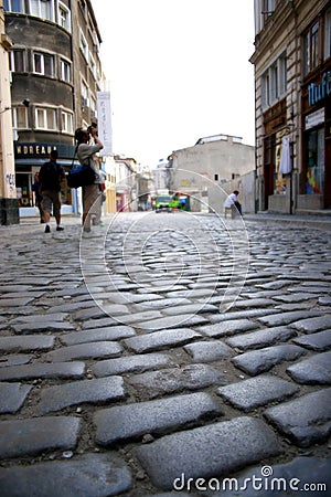 Photographer at work on an old city street Editorial Stock Photo