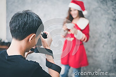 Photographer working with model in studio Stock Photo