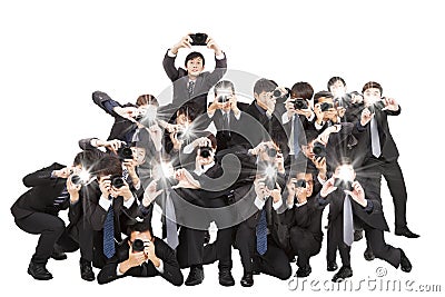 Photographers holding camera pointing to you Stock Photo