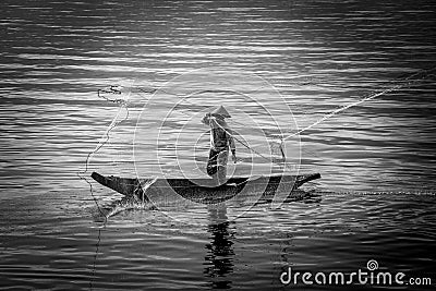 Photographic work of human activity while fishing on the shores of Singkarak Lake, West Sumatra, Indonesia. Editorial Stock Photo