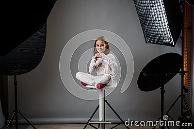 Photographing children in professional photo studio with lighting equipment Stock Photo