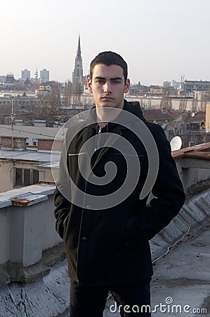 Photographing Danila MaziÄ‡ with a black coat and black pants a background sunset Stock Photo