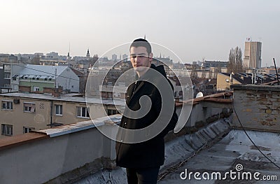 Photographing Danila MaziÄ‡ with a black coat and black pants a background sunset Stock Photo