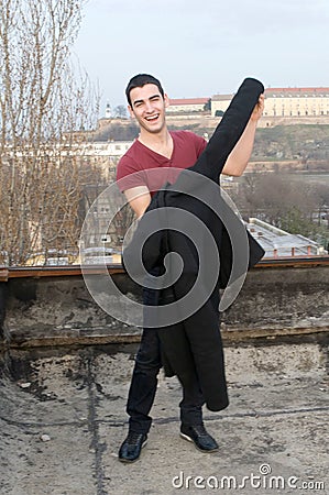 Photographing Danila MaziÄ‡ on old roof with a background Petrovaradin fortress and Danube river Stock Photo