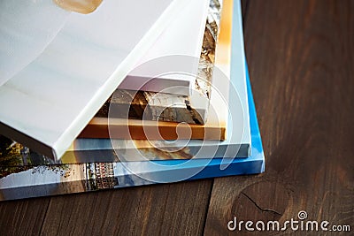 Photography canvas prints. Stacked colorful photos with gallery wrapping method of canvas stretching on stretcher bar Stock Photo