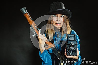 Steampunk with old retro camera and pistol Stock Photo