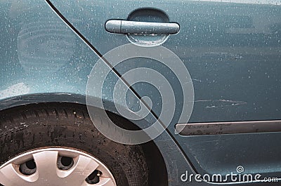 Scratched car on the back door - detail of damaged blue car Stock Photo