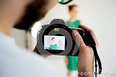 Photogtapher working in studio Stock Photo