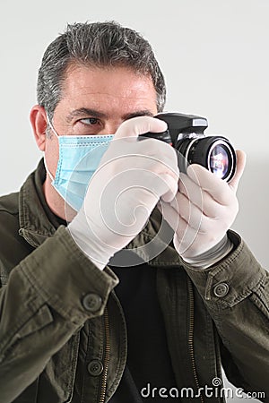 Photojournalist photographing the Coronaviruse pandemic COVID-19 outbreak Stock Photo