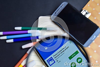 Photos Companion, a Microsoft Garage Project App with magnifying on Smartphone screen. Editorial Stock Photo