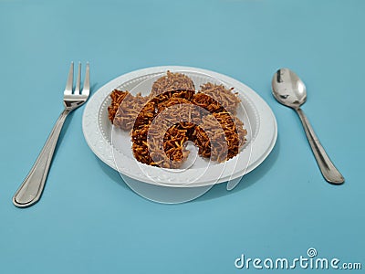 A market snack made from grated sweet potato that is fried has a sweet taste, the name is carang mas Stock Photo