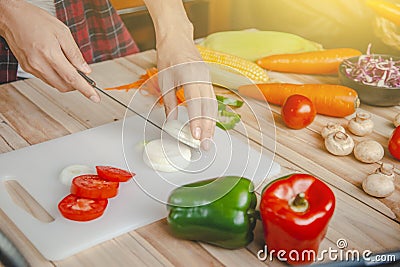 Photos of people cooking in the kitchen Can be used with various design media. Stock Photo