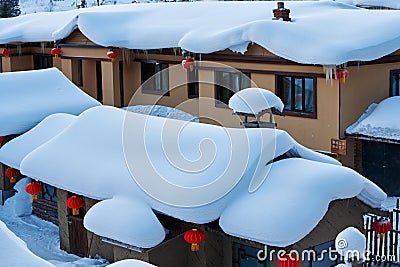 The thick snow on the houses scenery Stock Photo