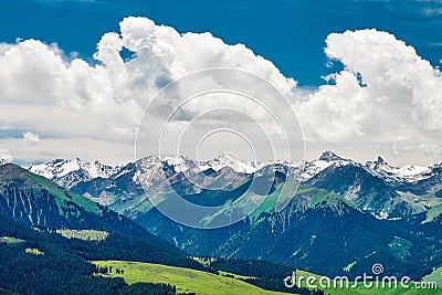The clouds, snow mountains and forests Stock Photo