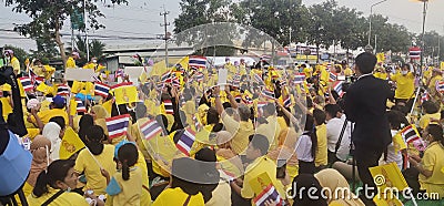 People wear yellow shirts shirts to greet their King. Editorial Stock Photo