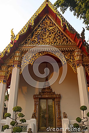 Phra Viharn Kod decorative entrance door and roof at Wat Pho temple. Stock Photo