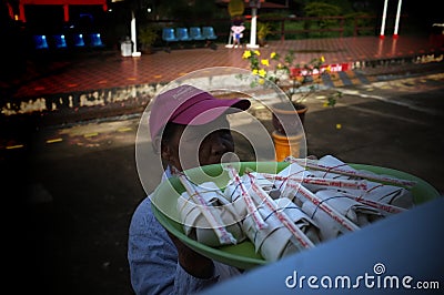 Phrae , Thailand : September 13 2019 : The vendor on the Thai train sell Red pork noodles at Ban Pin Railway Station Editorial Stock Photo