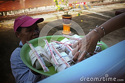 Phrae , Thailand : September 13 2019 : The vendor on the Thai train sell Red pork noodles at Ban Pin Railway Station Editorial Stock Photo