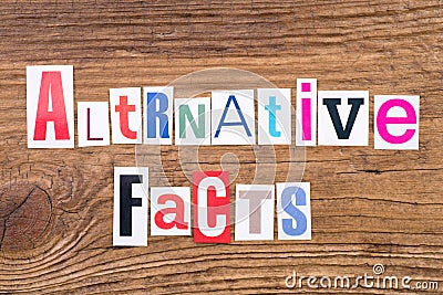 Phrase `Alternative Facts` on wooden background Stock Photo