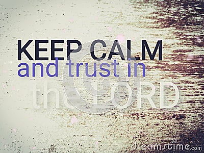 Short message saying Keep calm and trust in the Lord. Text on wood background saying keep calm and trust in the Lord. Stock Photo