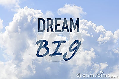 Phrase dream big on a blue clouded sky Stock Photo