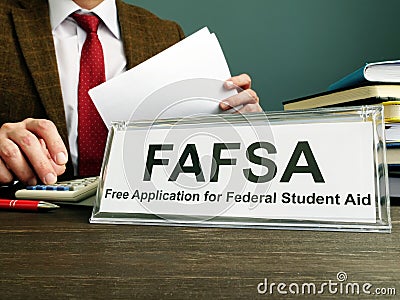 Phrase FAFSA Free Application for Federal Student Aid on the plate Editorial Stock Photo