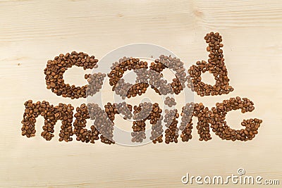 Phrase good morning made with coffee beans on a table top view Stock Photo