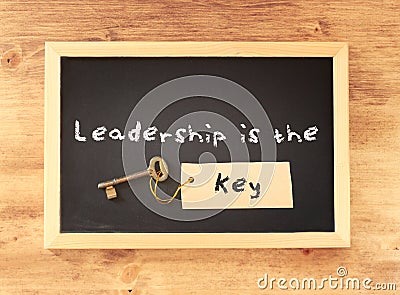 The phrase - leadership is the key written on blackboard. Stock Photo